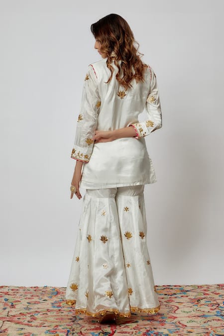 Shop Yuvraani Jaipur Ivory Silk, Organza Gota Patti, Embroidery V-neck Hand Kurta Sharara Set at Aza Fashions Shop_Yuvraani Jaipur_Ivory Silk, Organza Gota Patti, Embroidery V-neck Hand Kurta Sharara Set _at_Aza_Fashions