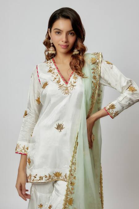 Buy Yuvraani Jaipur Ivory Silk, Organza Gota Patti, Embroidery V-neck Hand Kurta Sharara Set Online at Aza Fashions Buy_Yuvraani Jaipur_Ivory Silk, Organza Gota Patti, Embroidery V-neck Hand Kurta Sharara Set _Online_at_Aza_Fashions