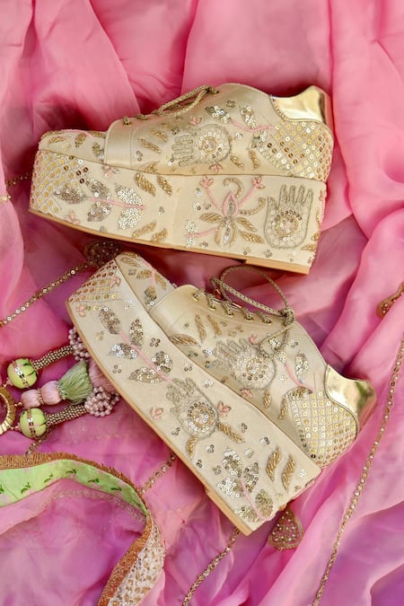 Shop Tiesta Gold Cut Work, Sequins, Beads, Embroidery Masaba Bridal Sneaker Platform Wedges at Aza Fashions Shop_Tiesta_Gold Cut Work, Sequins, Beads, Embroidery Masaba Bridal Sneaker Platform Wedges _at_Aza_Fashions