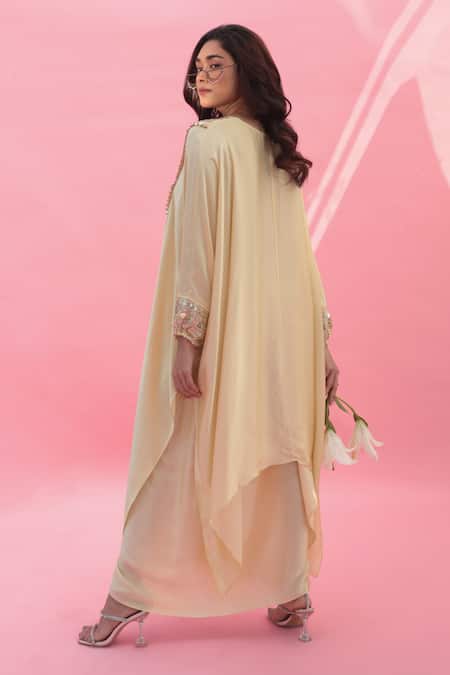 Shop Prahnaaya Yellow Satin Sequins V-neck Mish Embroidered Kaftan With Wrap Skirt at Aza Fashions Shop_Prahnaaya_Yellow Satin Sequins V-neck Mish Embroidered Kaftan With Wrap Skirt _at_Aza_Fashions