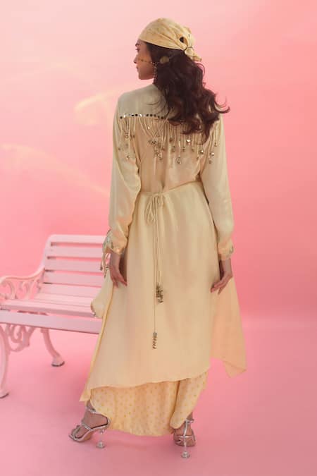 Shop Prahnaaya Yellow Satin Sequins Round Neck Saakura Embroidered Tunic With Dhoti Skirt at Aza Fashions Shop_Prahnaaya_Yellow Satin Sequins Round Neck Saakura Embroidered Tunic With Dhoti Skirt _at_Aza_Fashions