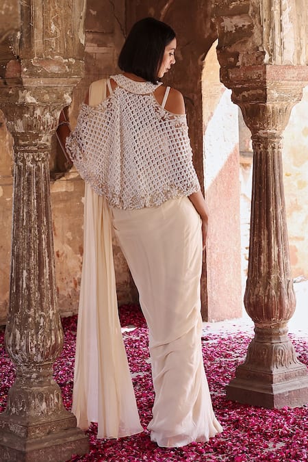 Shop Seema Thukral Ivory Georgette Pearls, Sequins, Diya Embellished Cape Pre-stitched Saree Set at Aza Fashions Shop_Seema Thukral_Ivory Georgette Pearls, Sequins, Diya Embellished Cape Pre-stitched Saree Set _at_Aza_Fashions