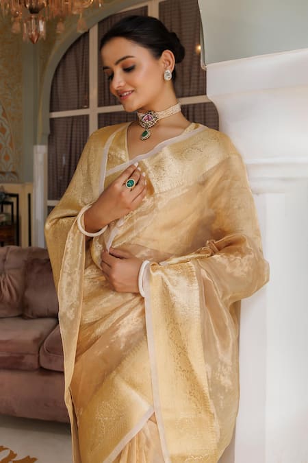 Shop Geroo Jaipur Gold Tissue Zari Lotus Border Woven Saree With Unstitched Blouse Piece Online at Aza Fashions Shop_Geroo Jaipur_Gold Tissue Zari Lotus Border Woven Saree With Unstitched Blouse Piece _Online_at_Aza_Fashions