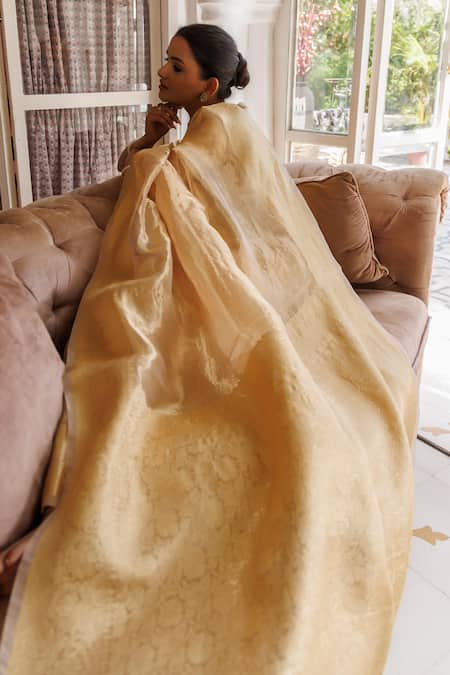 Geroo Jaipur Gold Tissue Zari Lotus Border Woven Saree With Unstitched Blouse Piece at Aza Fashions Geroo Jaipur_Gold Tissue Zari Lotus Border Woven Saree With Unstitched Blouse Piece _at_Aza_Fashions