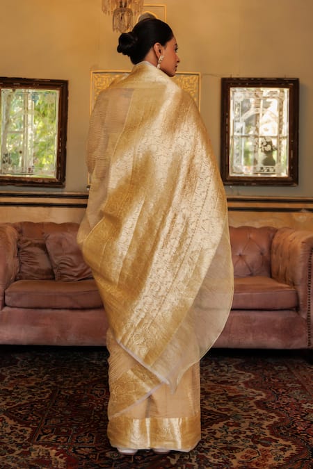 Shop Geroo Jaipur Gold Tissue Zari Floral Vine Woven Saree With Unstitched Blouse Piece at Aza Fashions Shop_Geroo Jaipur_Gold Tissue Zari Floral Vine Woven Saree With Unstitched Blouse Piece _at_Aza_Fashions