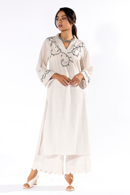 Pants and Pajamas White Cotton Embroidered Thread V Neck Floral Work Kurta And Flared Pant Set 