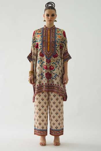 Rajdeep Ranawat_Beige Modal, Satin Permaz Bouquet Print Flared Pant _Online_at_Aza_Fashions
