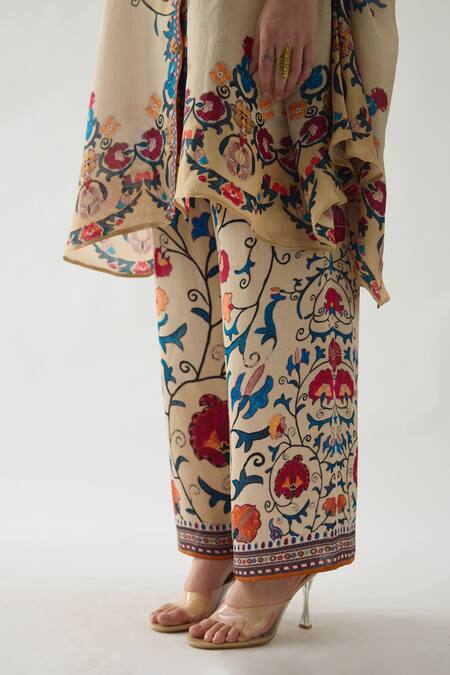 Rajdeep Ranawat_Beige Modal, Satin Permaz Floral Vine Print Flared Pant _at_Aza_Fashions