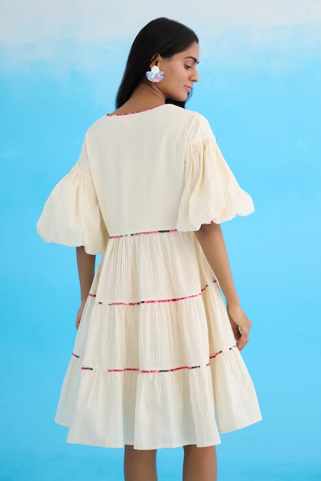 Shop Nikasha Cream Cotton Beads, Applique V-neck Bubble Sleeves Tiered Dress at Aza Fashions Shop_Nikasha_Cream Cotton Beads, Applique V-neck Bubble Sleeves Tiered Dress _at_Aza_Fashions