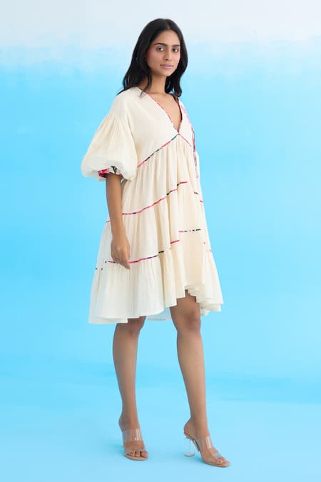 Buy Nikasha Cream Cotton Beads, Applique V-neck Bubble Sleeves Tiered Dress Online at Aza Fashions Buy_Nikasha_Cream Cotton Beads, Applique V-neck Bubble Sleeves Tiered Dress _Online_at_Aza_Fashions