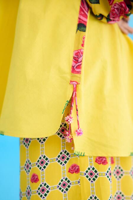 Buy Nikasha Yellow Cotton Sequins Bandeau Neck Rose Print Bubble Sleeve Raglan Shirt Online at Aza Fashions Buy_Nikasha_Yellow Cotton Sequins Bandeau Neck Rose Print Bubble Sleeve Raglan Shirt _Online_at_Aza_Fashions