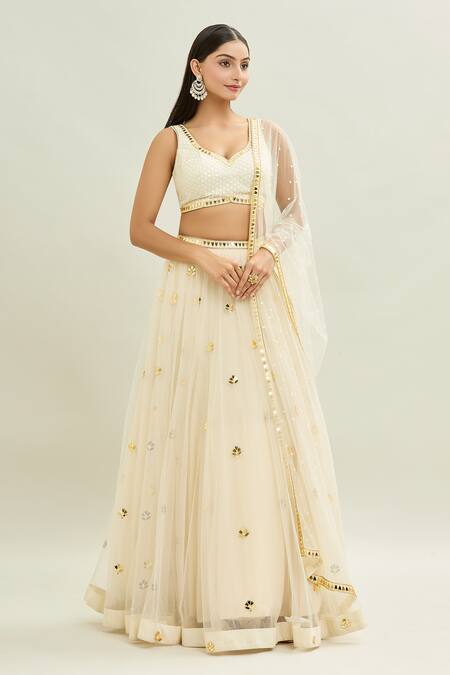 Aaryaa By Kashveen Kohli_Ivory Net Applique, Embroidery Sweetheart Neck Acrylic Lehenga Set _Online_at_Aza_Fashions