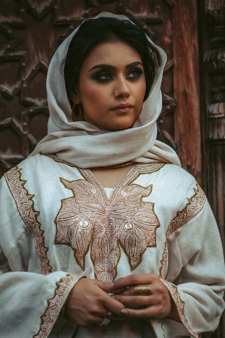 Shop Tulpalav White Pashmina, Wool Embroidery Collared Tilla Hand Work Pheran Kurta Salwar Set Online at Aza Fashions Shop_Tulpalav_White Pashmina, Wool Embroidery Collared Tilla Hand Work Pheran Kurta Salwar Set_Online_at_Aza_Fashions