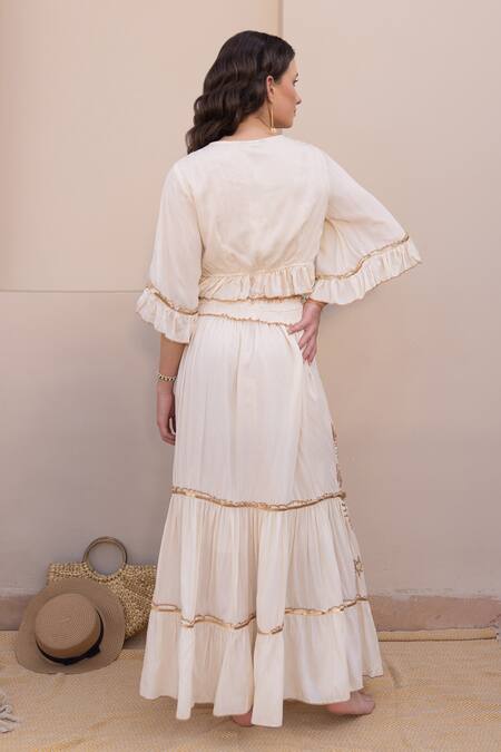 Shop Label Reyya Off White Cotton Sequins, Embroidery V-neck Moon Star Top And Skirt Set at Aza Fashions Shop_Label Reyya_Off White Cotton Sequins, Embroidery V-neck Moon Star Top And Skirt Set_at_Aza_Fashions