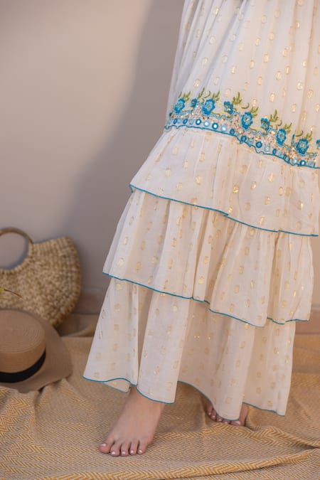 Shop Label Reyya White Cotton Embroidery, Sequins V-neck Tiered Floral Thread Gown Online at Aza Fashions Shop_Label Reyya_White Cotton Embroidery, Sequins V-neck Tiered Floral Thread Gown_Online_at_Aza_Fashions
