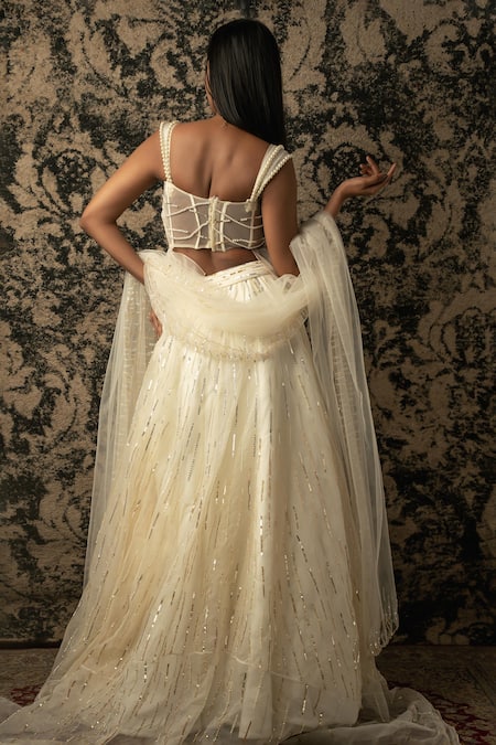 Shop_Jigar & Nikita_Ivory , Net, Silk Sequins, Cut Stripe Embroidered Lehenga Set _at_Aza_Fashions