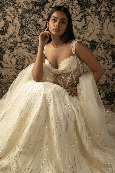 Jigar & Nikita_Ivory , Net, Silk Sequins, Cut Stripe Embroidered Lehenga Set _Online_at_Aza_Fashions