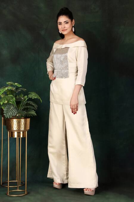 Buy_Nidhi Kejriwal_Cream Satin Cut Work, Embroidery Off-shoulder Cutdana Top And Palazzo Set _Online_at_Aza_Fashions