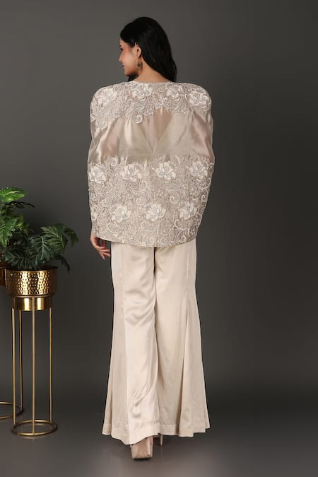 Shop Nidhi Kejriwal Ivory Georgette, Tissue, Satin Embroidery Plunge Neck Cutwork Cape Palazzo Set at Aza Fashions Shop_Nidhi Kejriwal_Ivory Georgette, Tissue, Satin Embroidery Plunge Neck Cutwork Cape Palazzo Set _at_Aza_Fashions