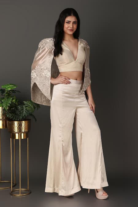 Nidhi Kejriwal Ivory Georgette, Tissue, Satin Embroidery Plunge Neck Cutwork Cape Palazzo Set at Aza Fashions Nidhi Kejriwal_Ivory Georgette, Tissue, Satin Embroidery Plunge Neck Cutwork Cape Palazzo Set _at_Aza_Fashions