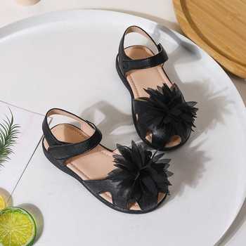 Ninobello_Black Fabric Flowers Embellished Sandals_at_Aza_Fashions