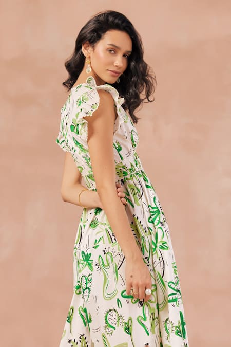 Shop NOIB Off White Cotton Plunge Neck Estella Cactus Print Tiered Dress at Aza Fashions Shop_NOIB_Off White Cotton Plunge Neck Estella Cactus Print Tiered Dress _at_Aza_Fashions