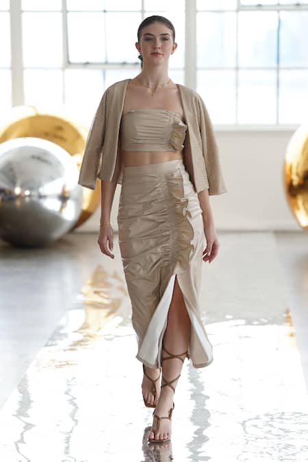 Shop Tara And I Beige Faux Leather Ruffles Ruched Skirt at Aza Fashions Shop_Tara And I_Beige Faux Leather Ruffles Ruched Skirt _at_Aza_Fashions