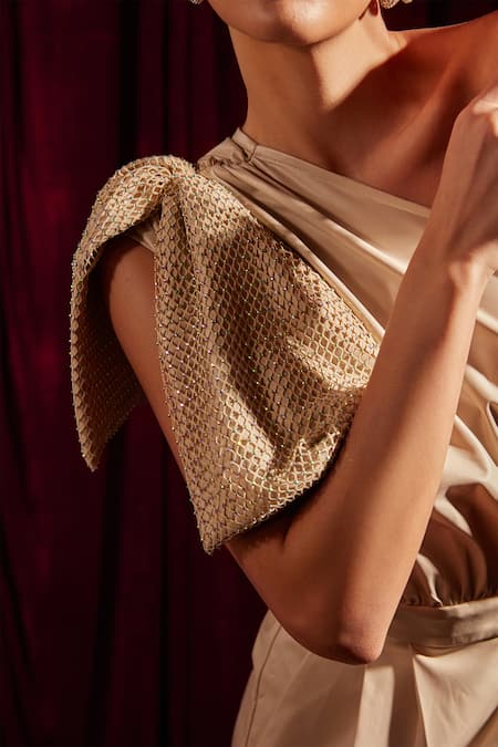 Buy Tara And I Beige Faux Leather One Shoulder Mesh Bow Embellished Playsuit Online at Aza Fashions Buy_Tara And I_Beige Faux Leather One Shoulder Mesh Bow Embellished Playsuit_Online_at_Aza_Fashions