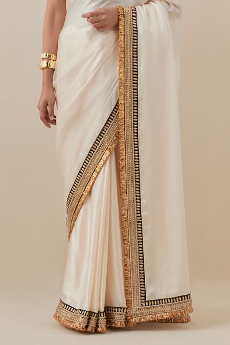 Priyal Prakash_Ivory Silk Satin, Silk, Polyester Beads, Sequins, Zari Border Saree With Blouse _Online_at_Aza_Fashions
