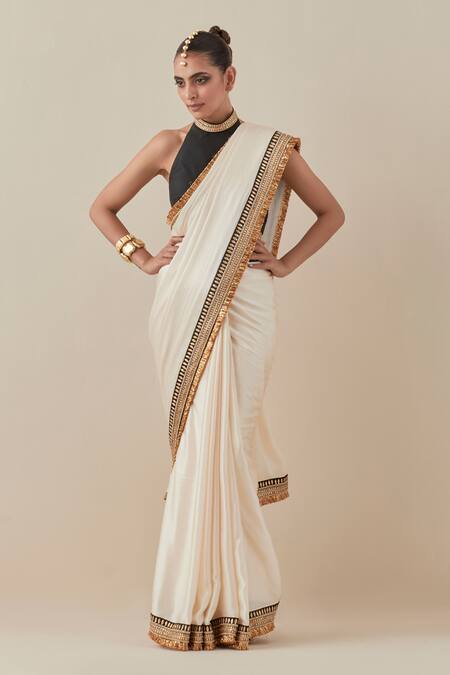Priyal Prakash_Ivory Silk Satin, Silk, Polyester Beads, Sequins, Zari Border Saree With Blouse _at_Aza_Fashions