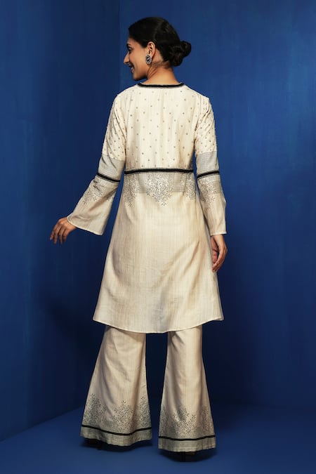 Krishna Mehta Beige Cotton Viscose Hand Block Printed Hem Floral Bell Bottom Pant Online at Aza Fashions Krishna Mehta_Beige Cotton Viscose Hand Block Printed Hem Floral Bell Bottom Pant _Online_at_Aza_Fashions