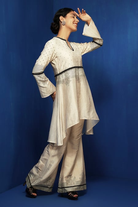 Buy Krishna Mehta Beige Cotton Viscose Hand Block Printed Hem Floral Bell Bottom Pant Online at Aza Fashions Buy_Krishna Mehta_Beige Cotton Viscose Hand Block Printed Hem Floral Bell Bottom Pant _Online_at_Aza_Fashions