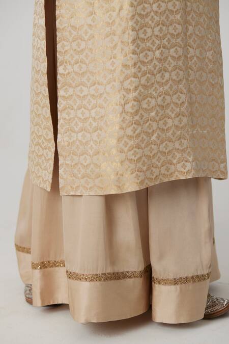 Rhua Ivory Silk, Brocade, Satin, Chiffon Prisha Bloom Jaal Woven Kurta Sharara Set at Aza Fashions Rhua_Ivory Silk, Brocade, Satin, Chiffon Prisha Bloom Jaal Woven Kurta Sharara Set _at_Aza_Fashions