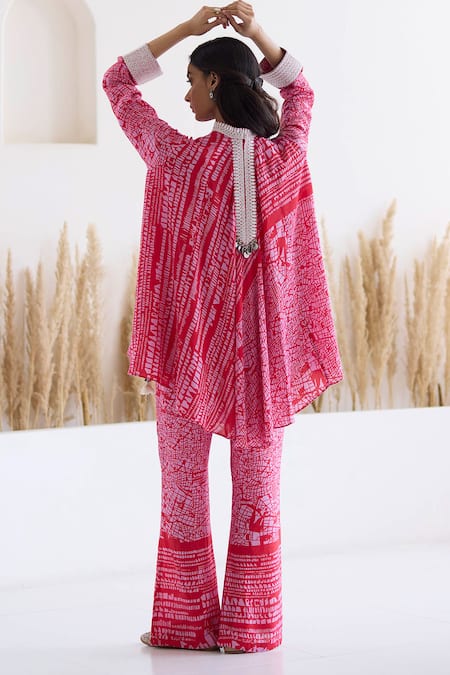 Shop Inej Red Cotton, Silk Tassels, Metallic Printed Draped Top And Bell Bottom Pant Set at Aza Fashions Shop_Inej_Red Cotton, Silk Tassels, Metallic Printed Draped Top And Bell Bottom Pant Set _at_Aza_Fashions