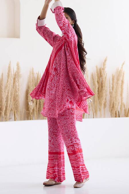 Buy Inej Red Cotton, Silk Tassels, Metallic Printed Draped Top And Bell Bottom Pant Set Online at Aza Fashions Buy_Inej_Red Cotton, Silk Tassels, Metallic Printed Draped Top And Bell Bottom Pant Set _Online_at_Aza_Fashions