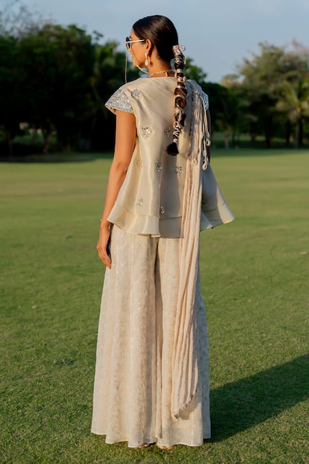Nikita Vishakha_Gold Tissue, Jacquard Mirrors, Tassels Embroidered Peplum Top Flared Pant Set _Online_at_Aza_Fashions