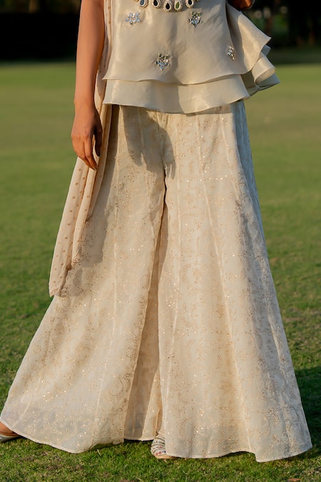 Buy_Nikita Vishakha_Gold Tissue, Jacquard Mirrors, Tassels Embroidered Peplum Top Flared Pant Set _Online_at_Aza_Fashions