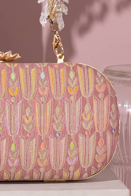 Shop Amyra Pink Embroidery, Tassels Titli Blossom Banarasi Silk Capsule Clutch Online at Aza Fashions Shop_Amyra_Pink Embroidery, Tassels Titli Blossom Banarasi Silk Capsule Clutch_Online_at_Aza_Fashions