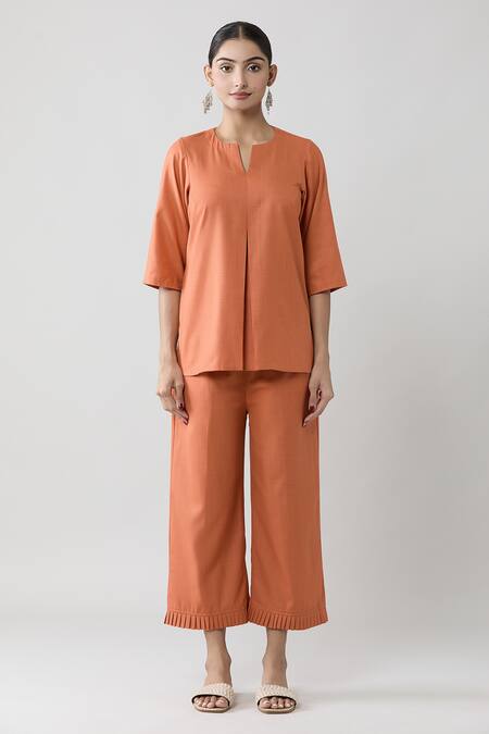 Naintara Bajaj Peach Keyhole Neck Pleated Top And Solid Pant Co-ord Set Online at Aza Fashions Naintara Bajaj_Peach Keyhole Neck Pleated Top And Solid Pant Co-ord Set _Online_at_Aza_Fashions
