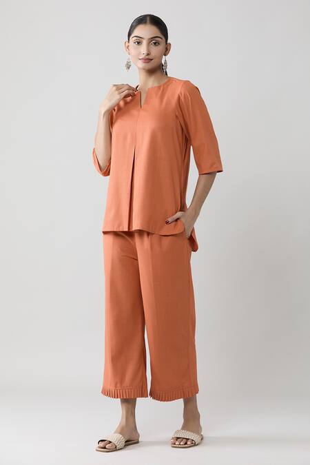 Buy Naintara Bajaj Peach Keyhole Neck Pleated Top And Solid Pant Co-ord Set Online at Aza Fashions Buy_Naintara Bajaj_Peach Keyhole Neck Pleated Top And Solid Pant Co-ord Set _Online_at_Aza_Fashions