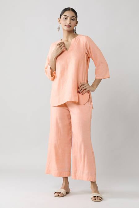 Buy Naintara Bajaj Peach Cotton Split V-neck Pintucked Solid Top And Pant Co-ord Set Online at Aza Fashions Buy_Naintara Bajaj_Peach Cotton Split V-neck Pintucked Solid Top And Pant Co-ord Set _Online_at_Aza_Fashions