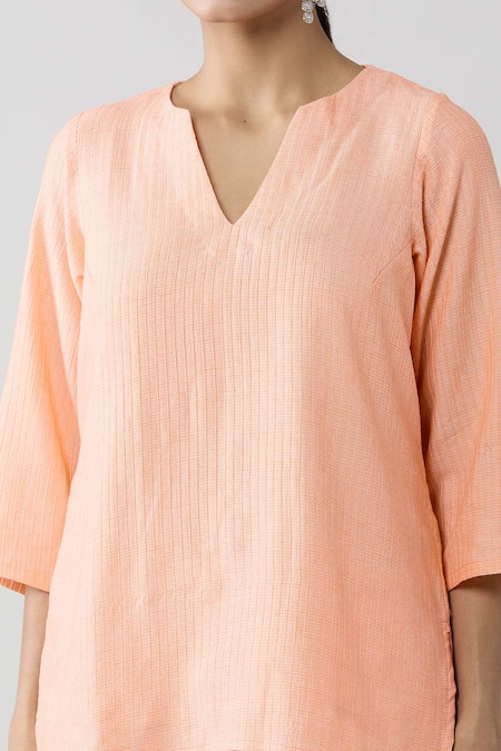 Shop Naintara Bajaj Peach Cotton Split V-neck Pintucked Solid Top And Pant Co-ord Set Online at Aza Fashions Shop_Naintara Bajaj_Peach Cotton Split V-neck Pintucked Solid Top And Pant Co-ord Set _Online_at_Aza_Fashions