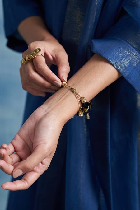 Shop Charkhee Gold Plated Embroidery Thread Bangle at Aza Fashions Shop_Charkhee_Gold Plated Embroidery Thread Bangle_at_Aza_Fashions