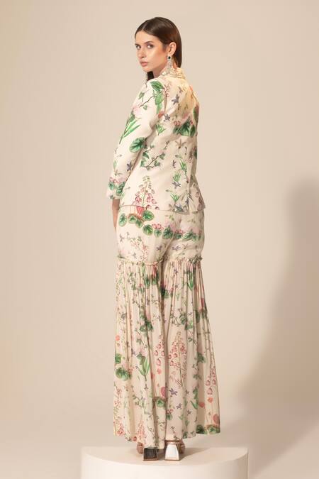 Shop SAKSHI GIRRI Ivory Crepe Sequins, Beads, Stones Botanical Pattern Blazer And Sharara Set at Aza Fashions Shop_SAKSHI GIRRI_Ivory Crepe Sequins, Beads, Stones Botanical Pattern Blazer And Sharara Set_at_Aza_Fashions