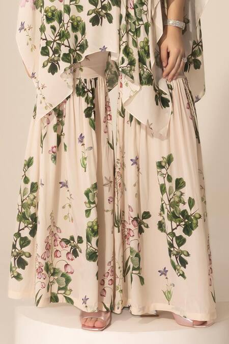SAKSHI GIRRI Ivory Crepe Sequins, Stones Botanical Print Cape And Sharara Set Online at Aza Fashions SAKSHI GIRRI_Ivory Crepe Sequins, Stones Botanical Print Cape And Sharara Set_Online_at_Aza_Fashions