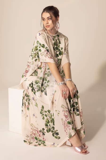 Buy SAKSHI GIRRI Ivory Crepe Sequins, Stones Botanical Print Cape And Sharara Set Online at Aza Fashions Buy_SAKSHI GIRRI_Ivory Crepe Sequins, Stones Botanical Print Cape And Sharara Set_Online_at_Aza_Fashions