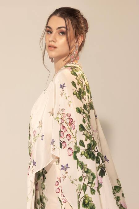Shop SAKSHI GIRRI Ivory Crepe Sequins, Stones Botanical Print Cape And Sharara Set Online at Aza Fashions Shop_SAKSHI GIRRI_Ivory Crepe Sequins, Stones Botanical Print Cape And Sharara Set_Online_at_Aza_Fashions