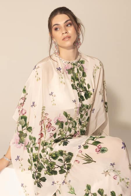SAKSHI GIRRI Ivory Crepe Sequins, Stones Botanical Print Cape And Sharara Set at Aza Fashions SAKSHI GIRRI_Ivory Crepe Sequins, Stones Botanical Print Cape And Sharara Set_at_Aza_Fashions
