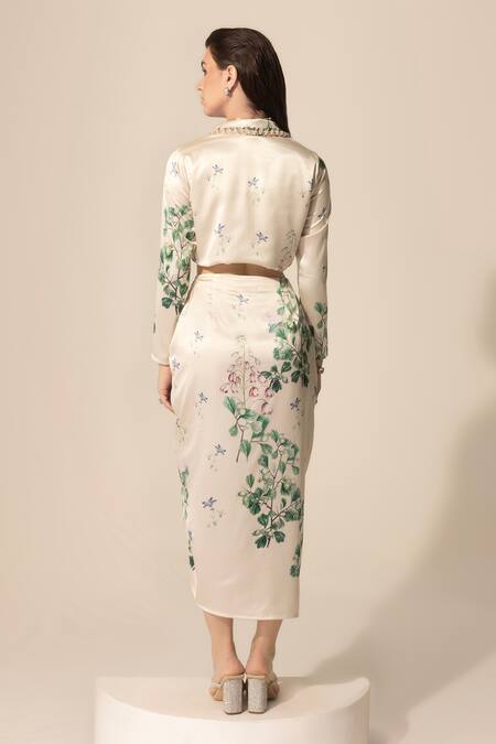 Shop SAKSHI GIRRI Ivory Satin Sequins, Beads, Stones Botanical Print Blazer And Skirt Set at Aza Fashions Shop_SAKSHI GIRRI_Ivory Satin Sequins, Beads, Stones Botanical Print Blazer And Skirt Set_at_Aza_Fashions