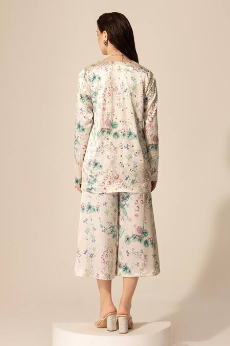 Shop SAKSHI GIRRI Beige Satin Sequins, Beads, Stones V-neck Botanical Print Top And Culotte Pant Set at Aza Fashions Shop_SAKSHI GIRRI_Beige Satin Sequins, Beads, Stones V-neck Botanical Print Top And Culotte Pant Set_at_Aza_Fashions